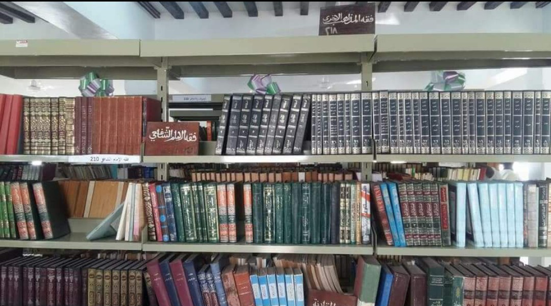 Photo of fiqh books on shelf, Riyadha, Lamu