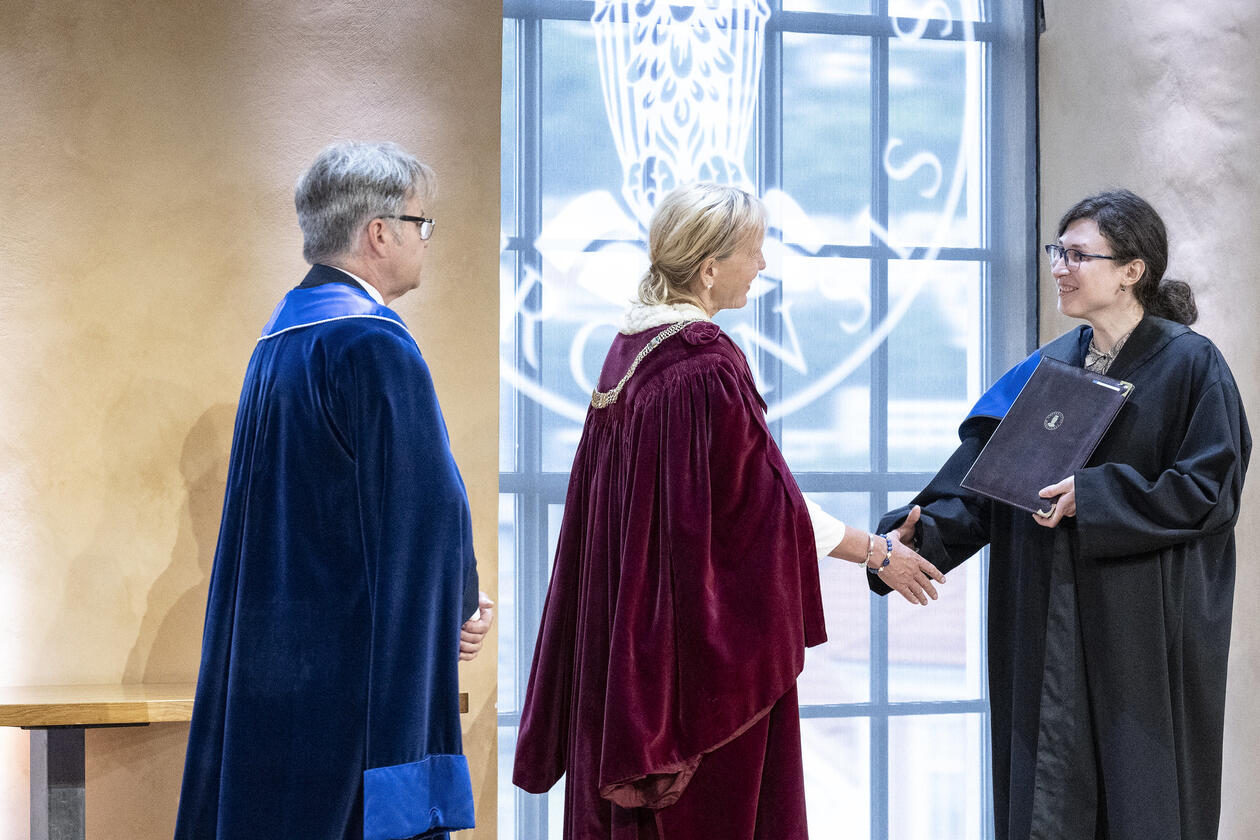 A new doctor is congratuated by the university's rector
