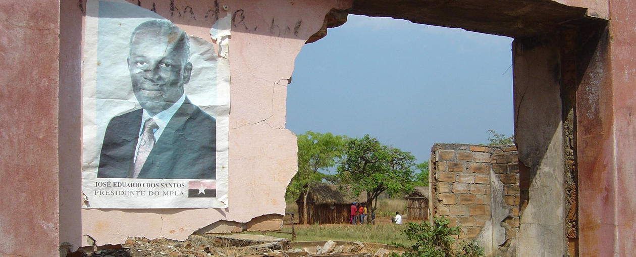 Poster of José Eduardo dos Santos on broken wall in Angola. 