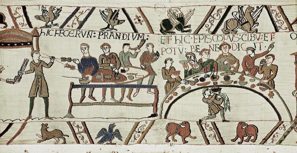 Scene from the Bayeux tapestry showing a medieval feast.