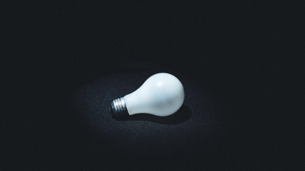 A light bulb on black background