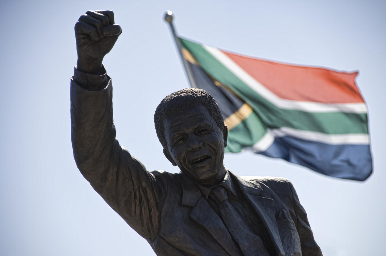 A statue of Nelson Mandela in front of the South African flag, used to accompany article on a democracy conference in Johannesburg 17-19 November 2014.