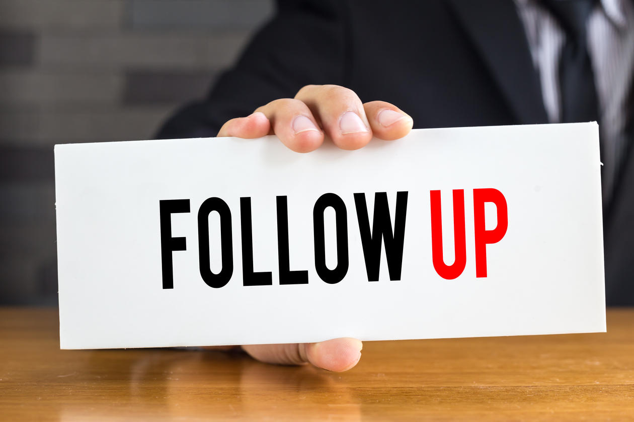 sign with the word follow up