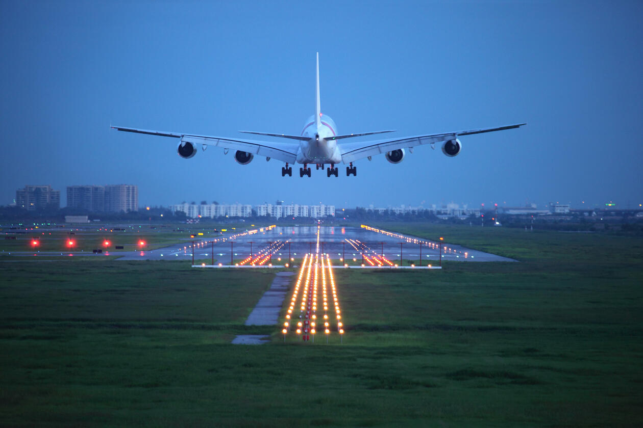 Airplane landing in the evening