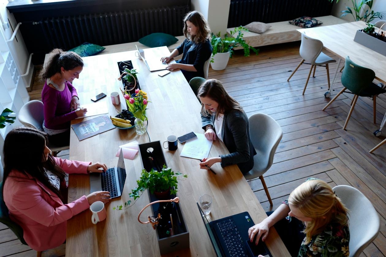 Group of people discussing around a table