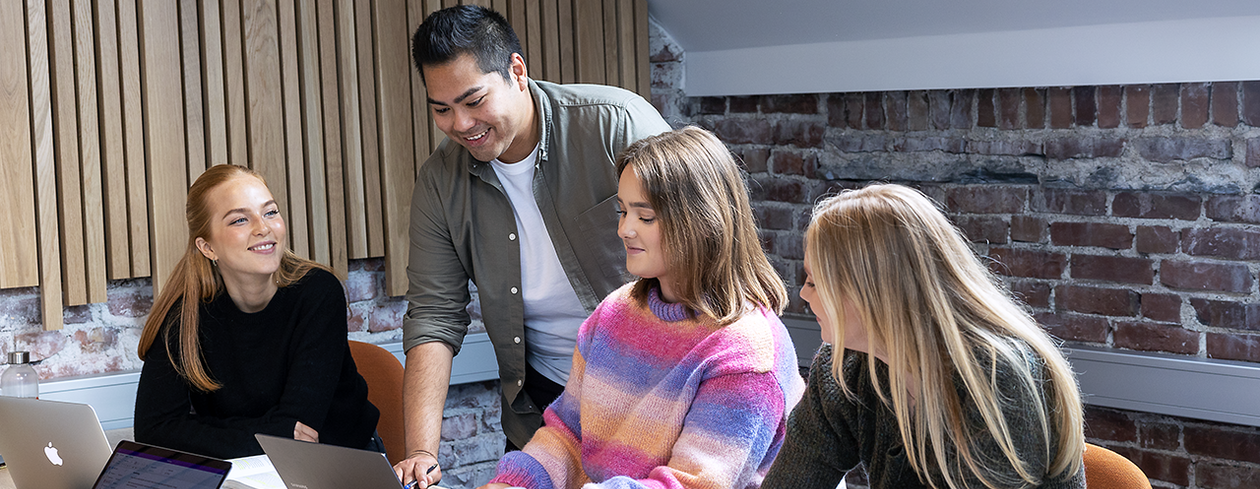 Four students studying together and discussing material