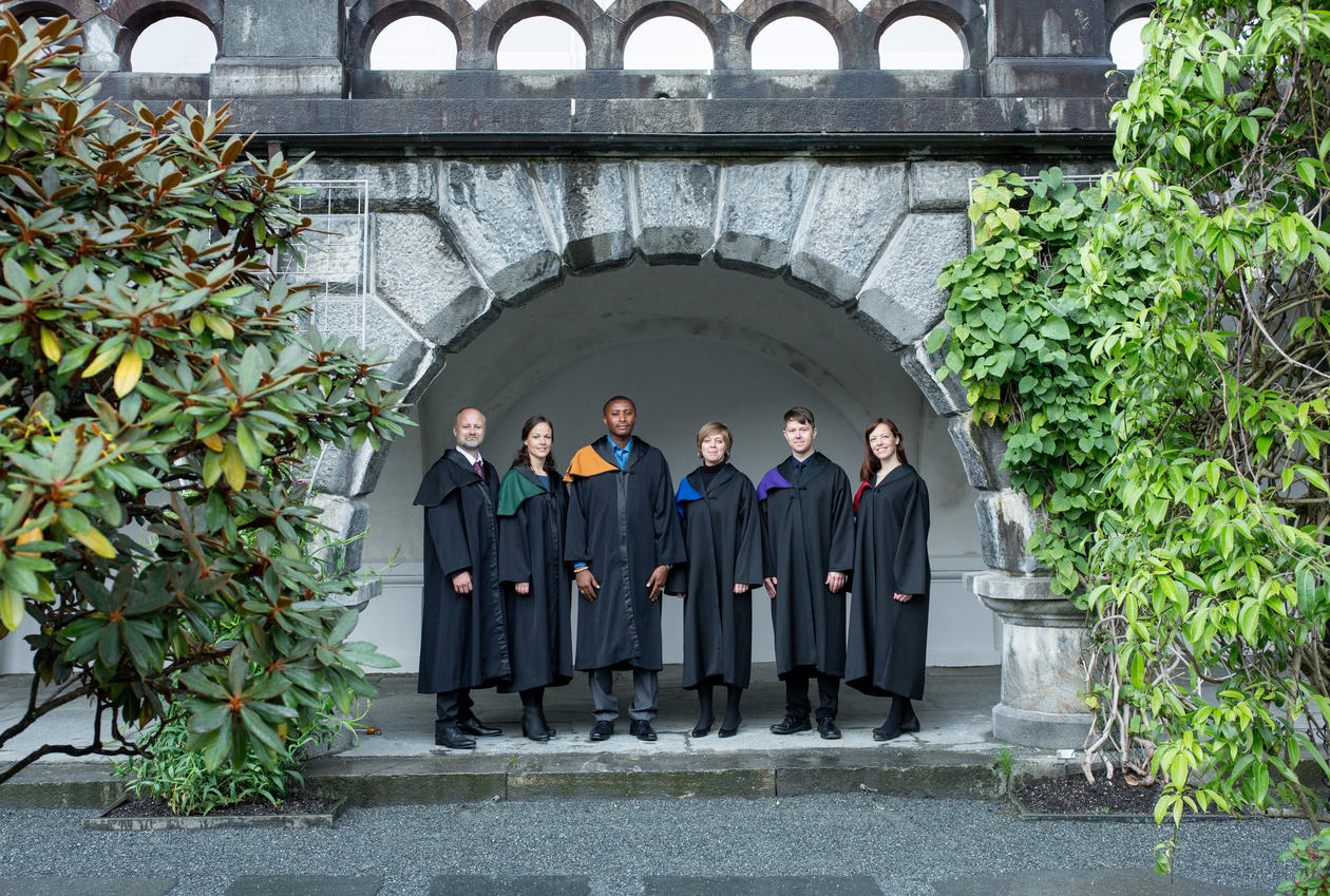 Six Ph.D. candidates in seremonial robes