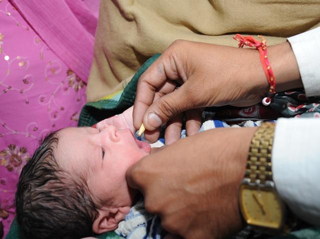 One of the babies in the Indian study receives its Vitamin A dose.