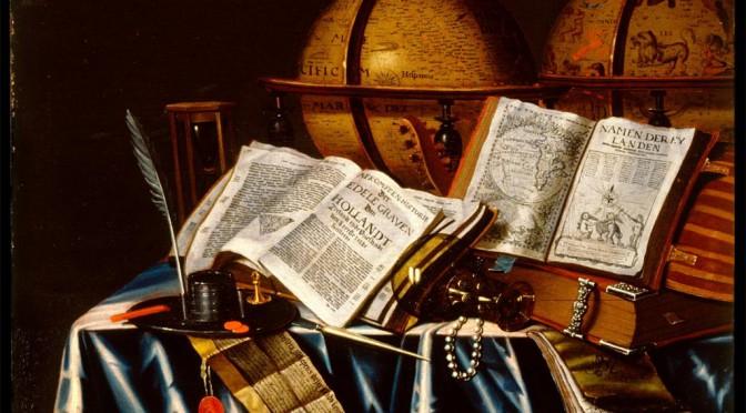 A table with different items from several hundred years ago, like pen and ink, books, old globes.