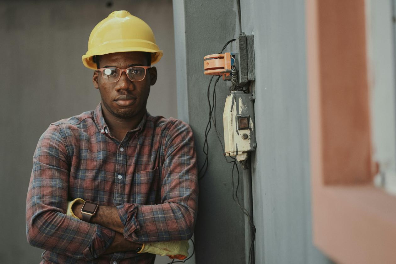 Portrait of a male architect at a building site looking at camera. 