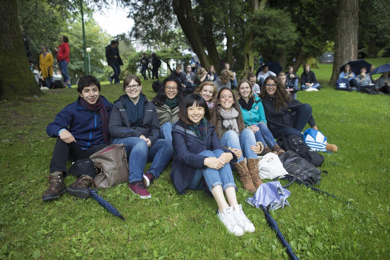 A group of students sitting in a park