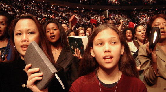 In a large churche were people are praising