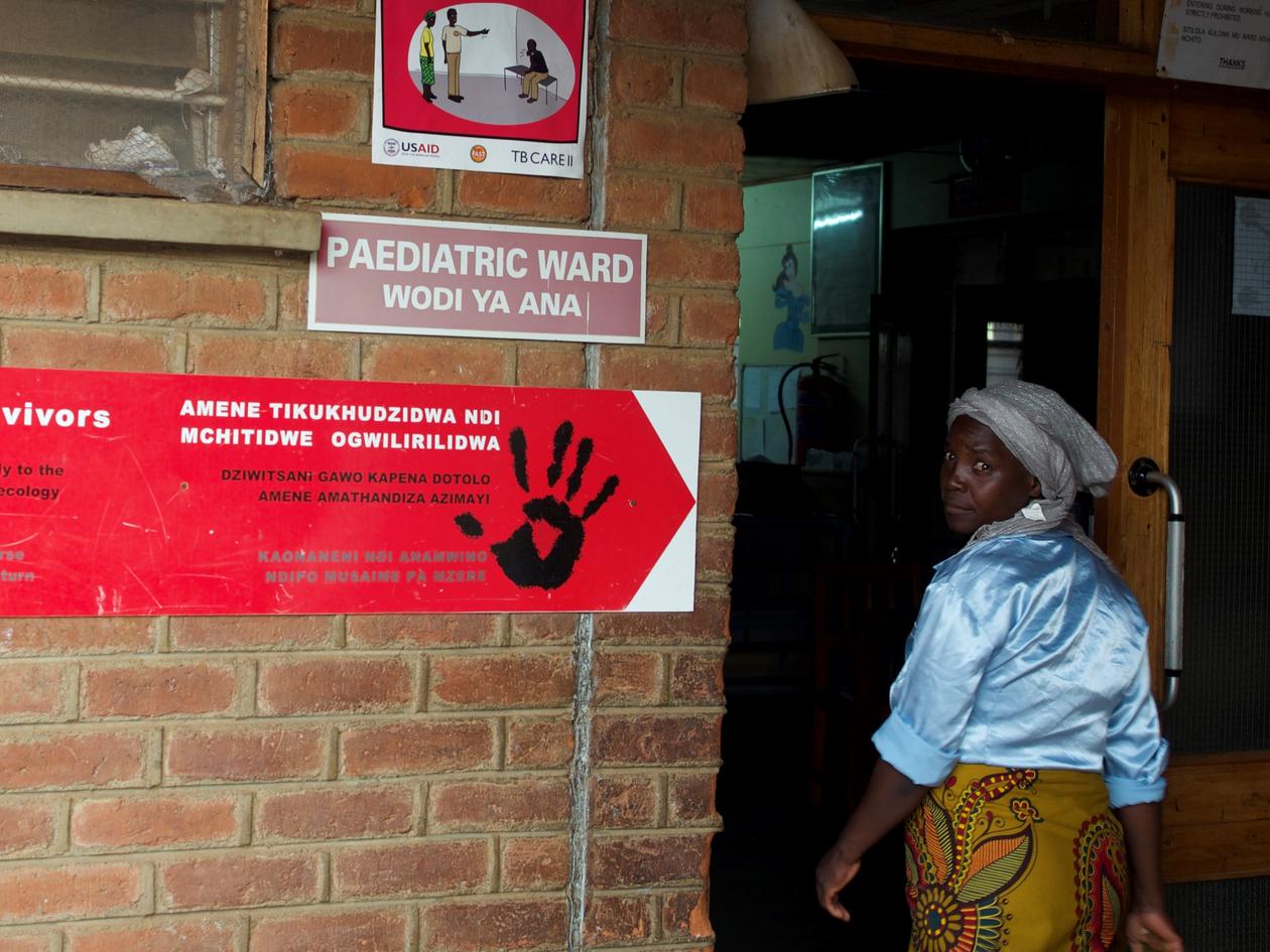 Woman entering pediatric health care fasility in Malawi 