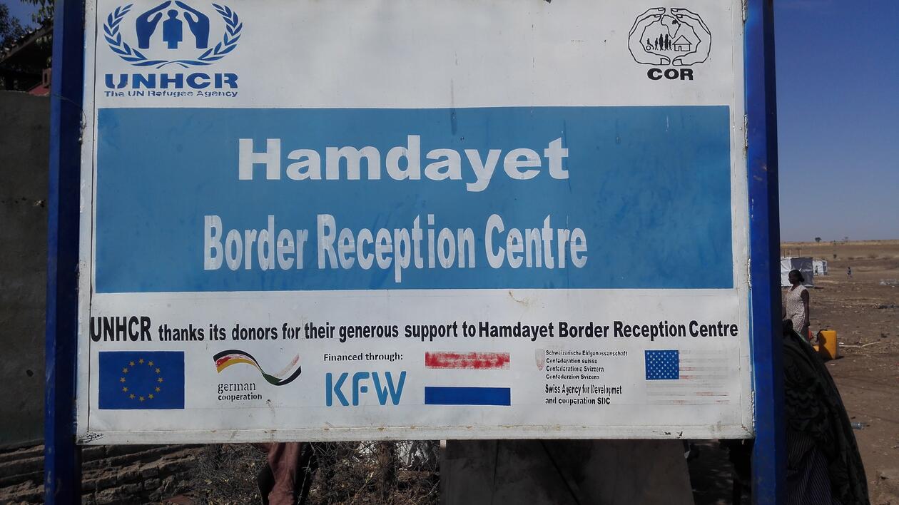 Poster that reads Hamdayet Border Reception Centre