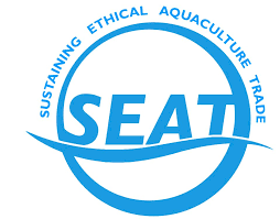 SEAT logo in blue: The abbreviation SEAT over a squiggle, surrounded by a circle. The following words written over the top of the circle: Sustaining Ethcial Aquaculture Trade