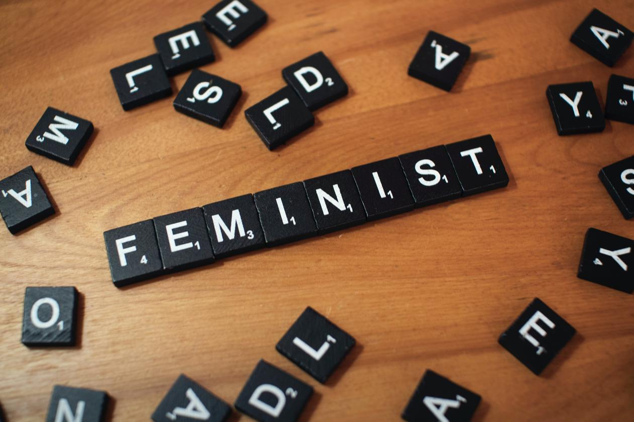Scrabble tiles spelling out feminism