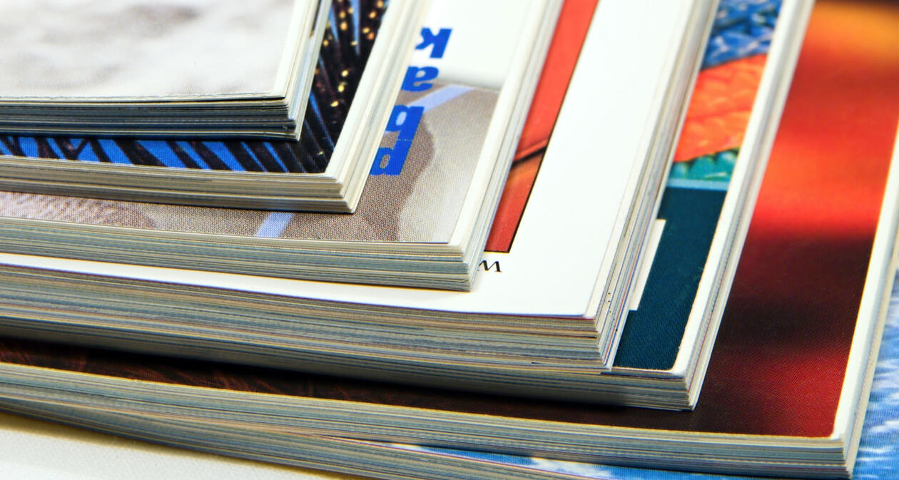 A stack of journals on a table.