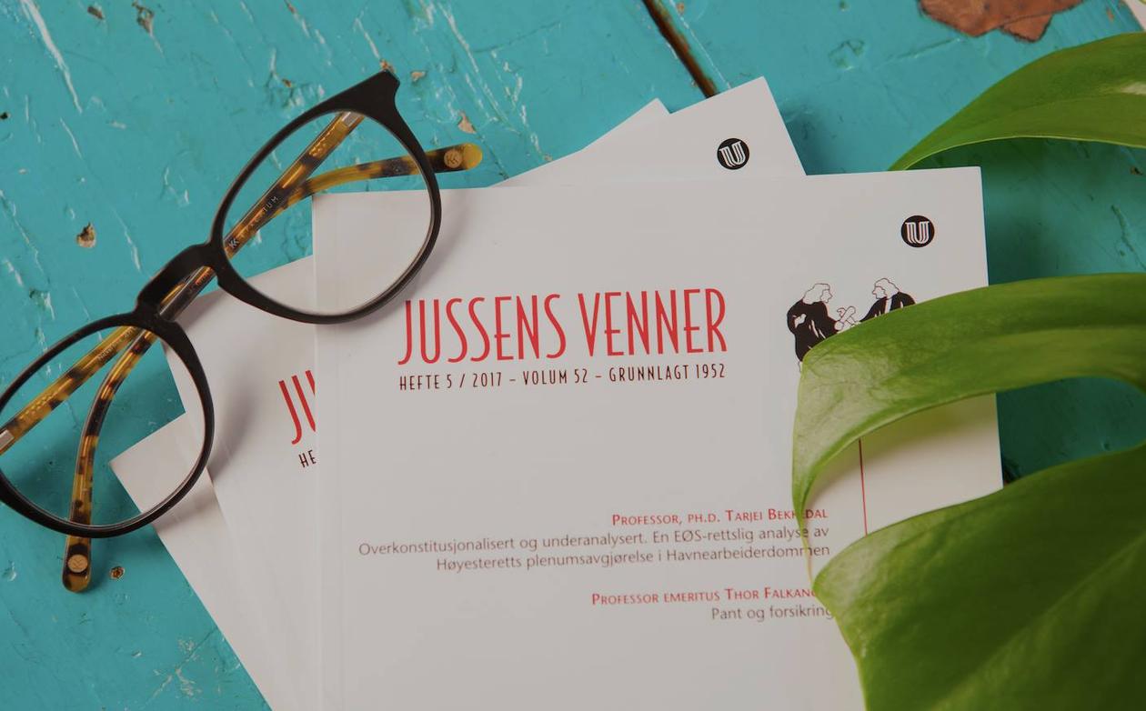 Logo Jussens venner og et par briller