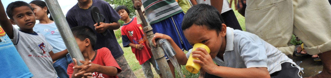 Kids drinking water from tap