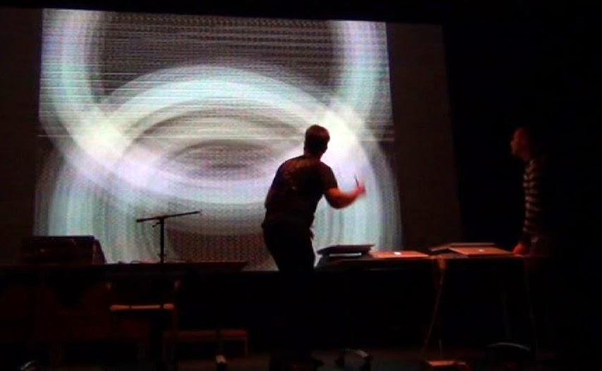 Person interacting with electronic literature on projected screen.