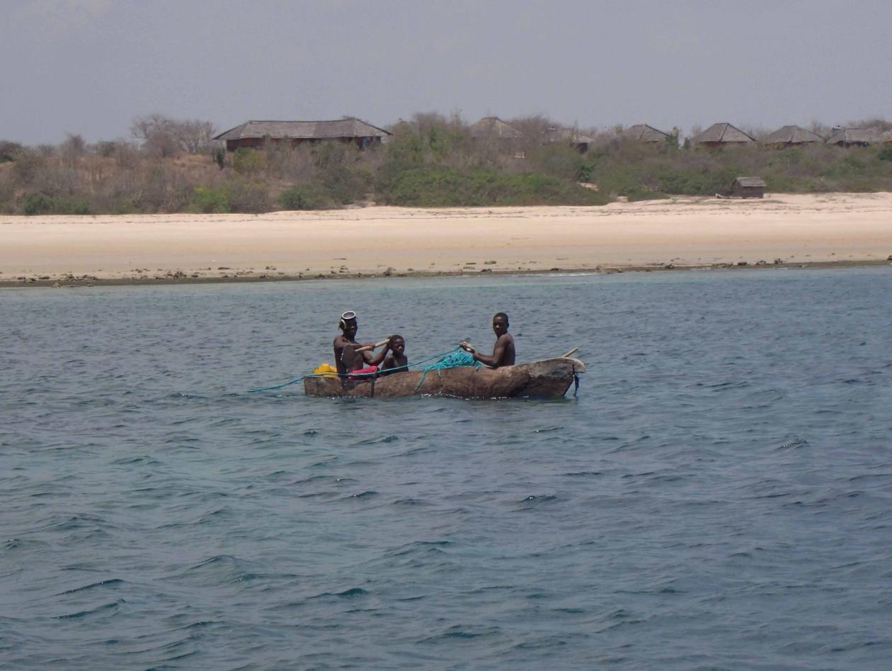 Local fishermen in a wooden canoe