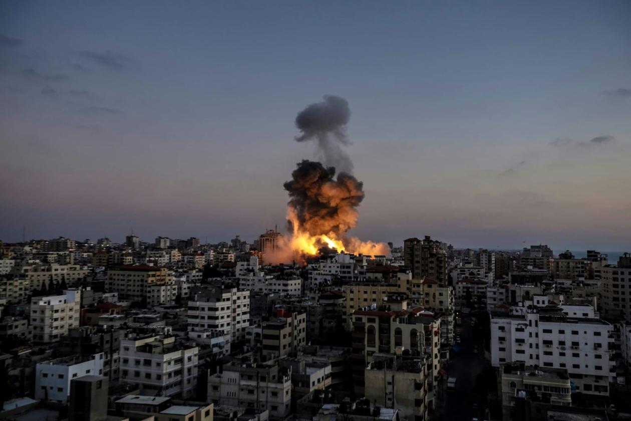 Gaza - Palestine A huge explosion in a building as a result of a bombing by Israeli warplanes.