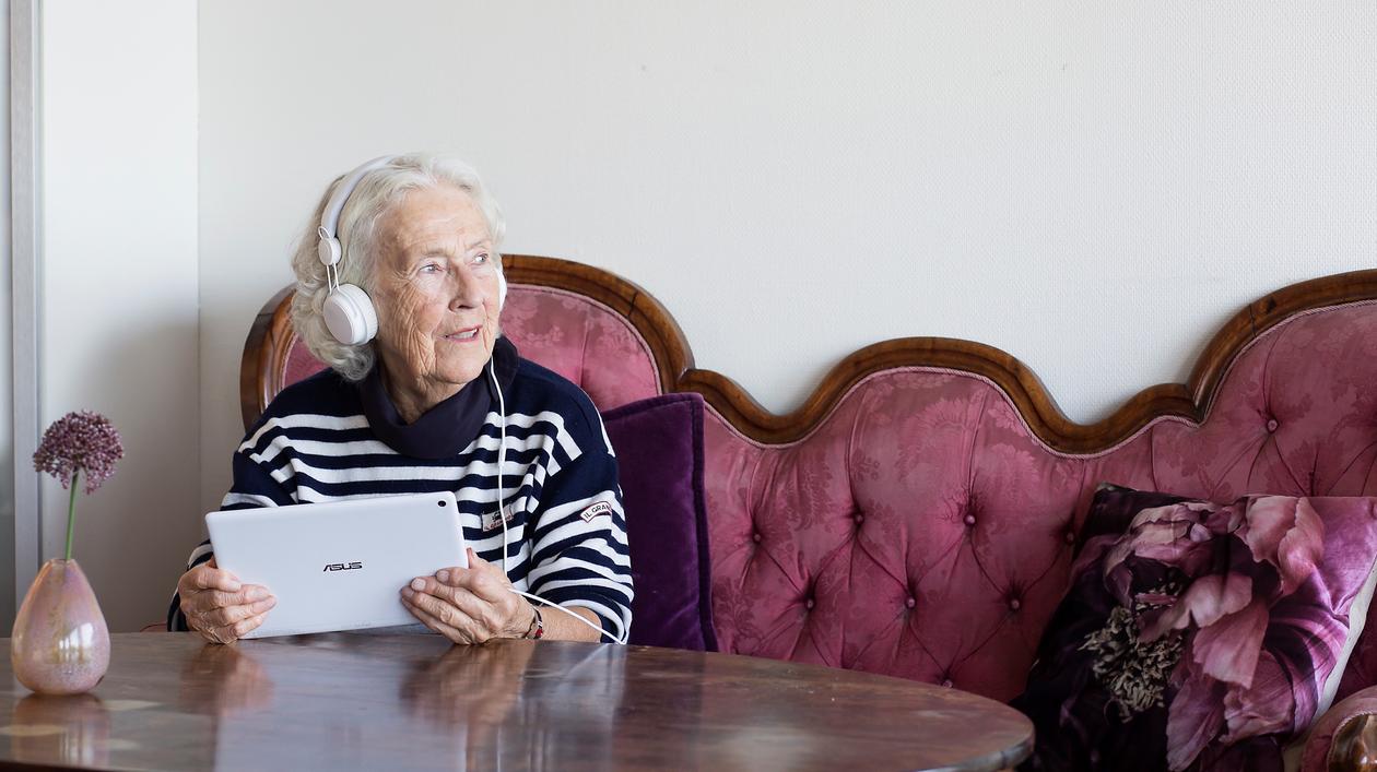 elderly woman using technology