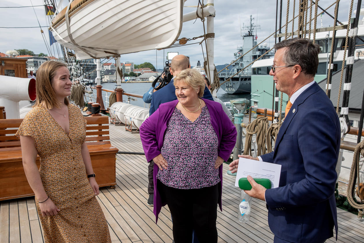 Student Thea Båtevik and Rector Dag Rune Olsen from the University of Bergen with Norway's Prime Minister Erna Solberg at the launch of the One Ocean Expedition on board tall ship Statsraad Lehmkuhl.