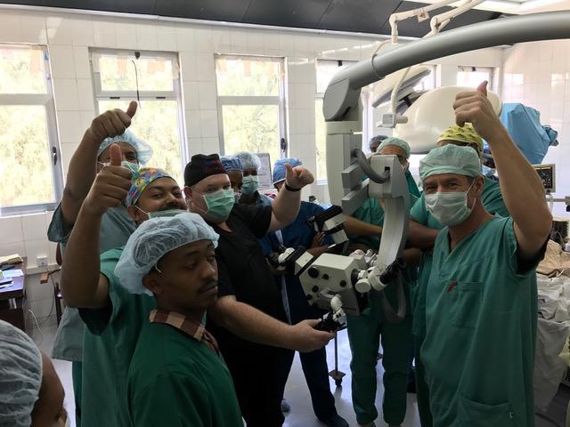 Neuro surgery team with new microscope