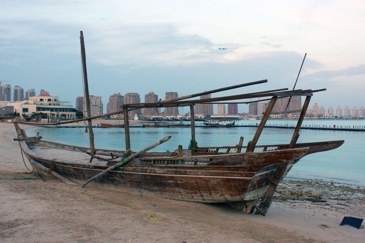 A dhow in front of the skyline of Doha, Qatar