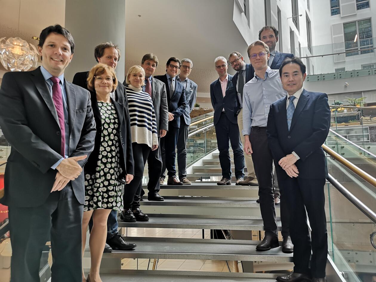 Participants in a staircase, smiling