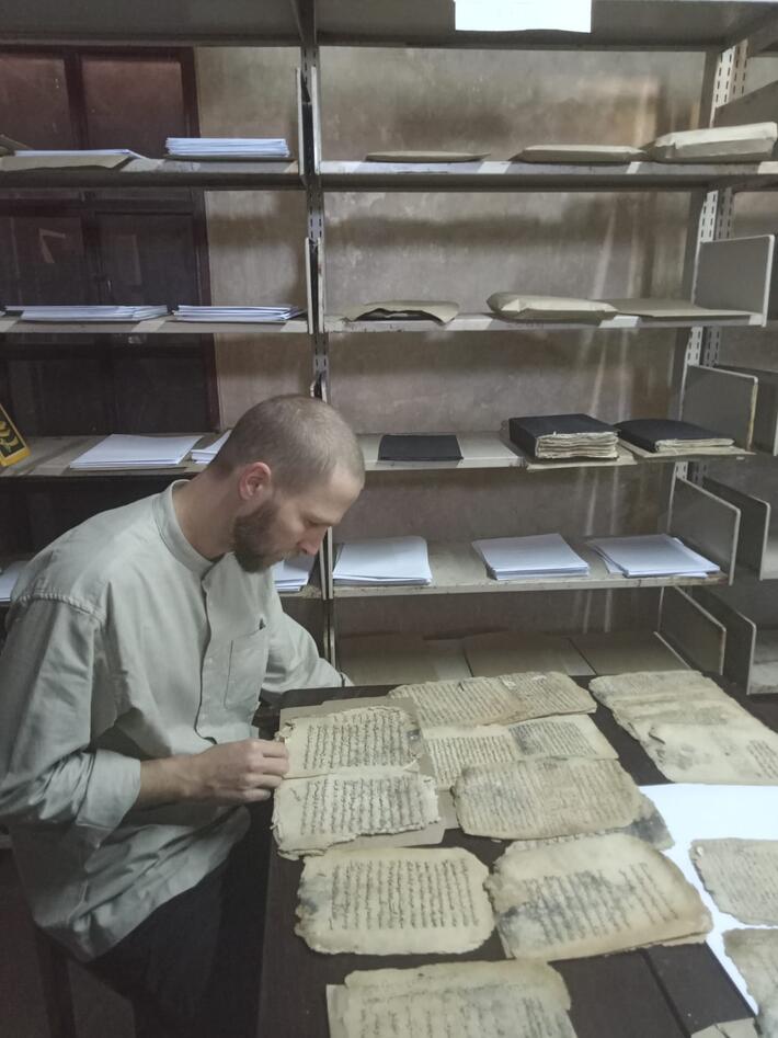 Raphael Michaeli studying old manuscripts
