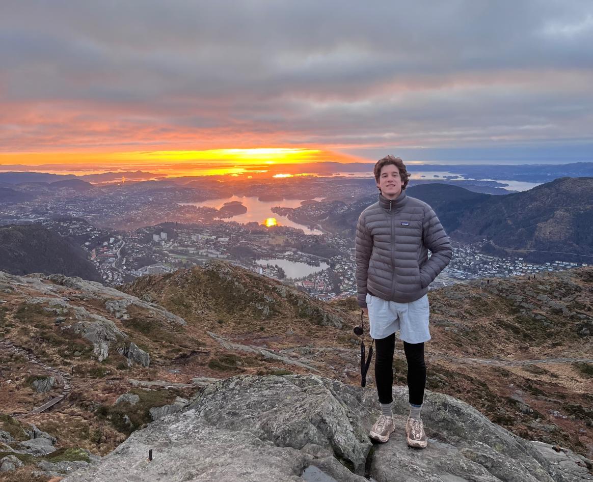 Student hiking mountain