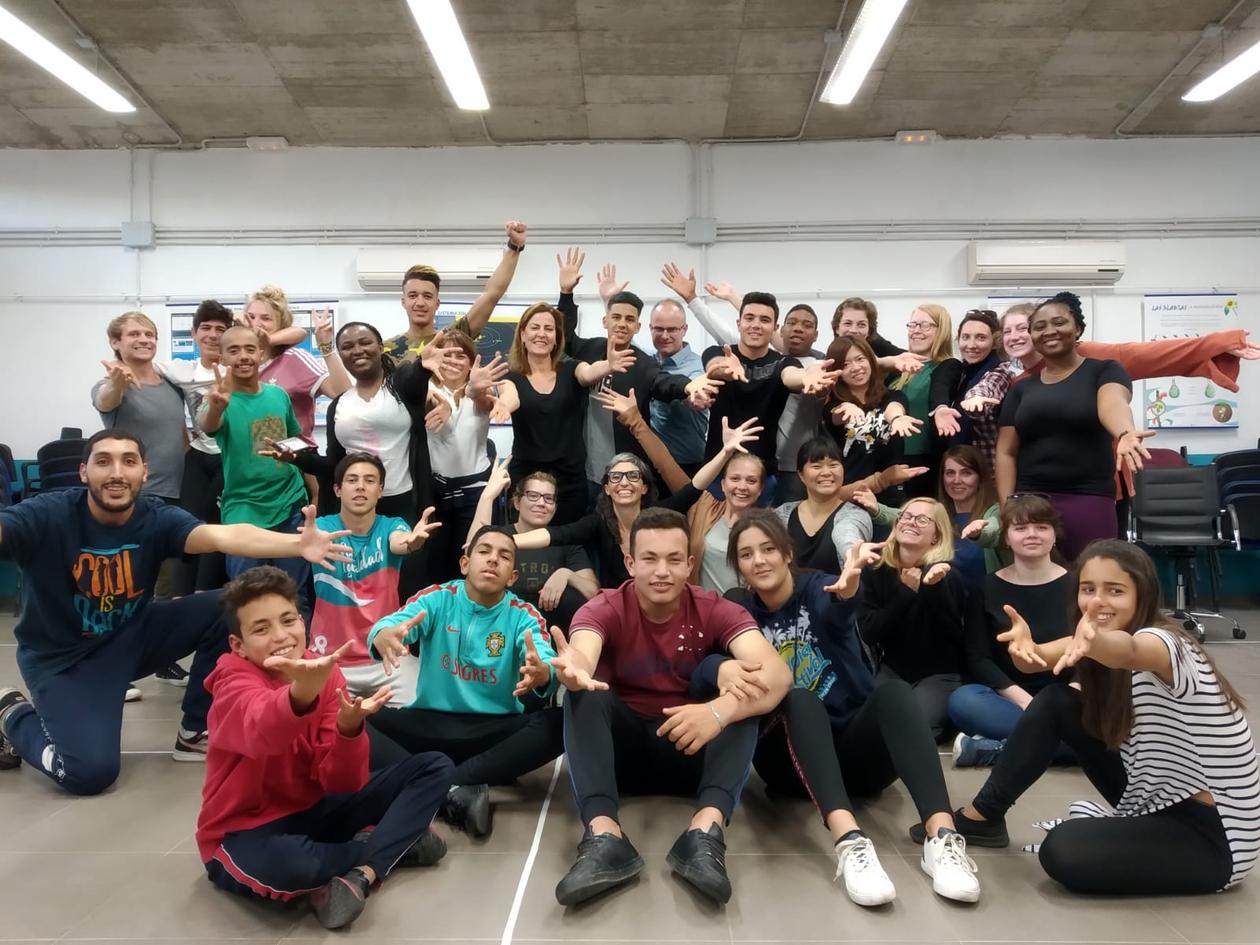 Students together with migrant children at a refugee centre in Melilla.