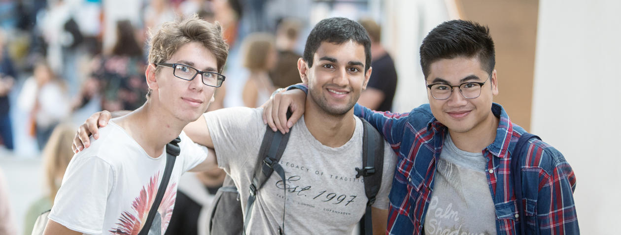 Three male students smiling