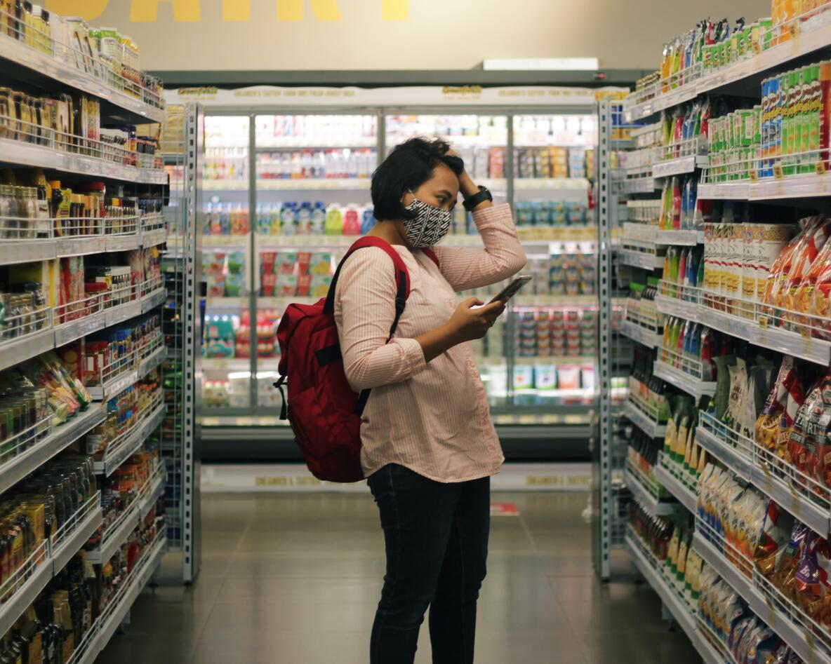 Woman with face mask in supermarket