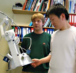 Kristian P. Nielsen and Lu Zhao with the first prototype of the instrument.