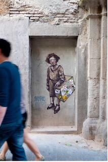 Street art of blindfolded refugee with suitcase. 