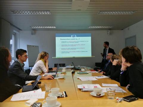 People having a meeting around a table