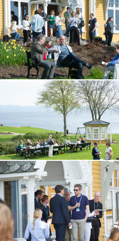 Audience at the CCBIO Annual Symposium gathered outside in breaks with fjord view at Solstrand.