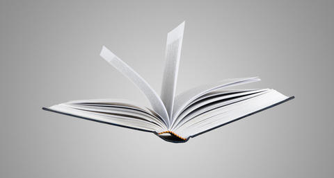 Image showing an open book flowing in mid-air