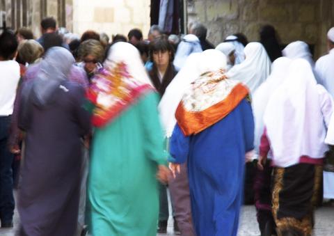 Group of Muslim women walking down the street