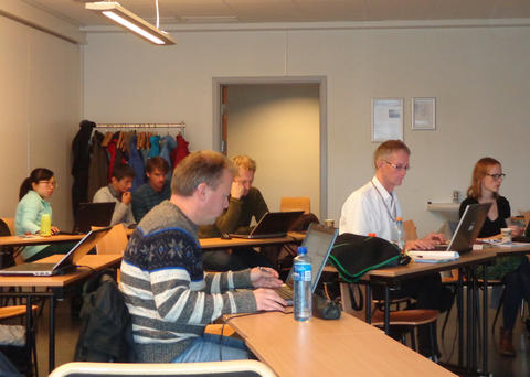 A view of the classroom with 7 participants of the Integrated Projection Models course