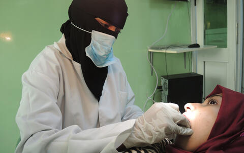 Dentist and patient in the clinic.