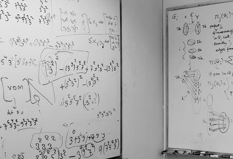 Two white boards filled with algorithms partially shown, from offices of the Algorithms Research Group at the University of Bergen.