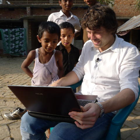 UiB researcher Researcher Scott Bremer with local children on a visit to the Khulna region in March 2012 during field work for an ethical seafood project.