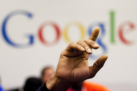 Hand with forefinger pointing upwards in front of the Google logo, used to illustrate article about legal challenges with privacy and search engines in the EU.