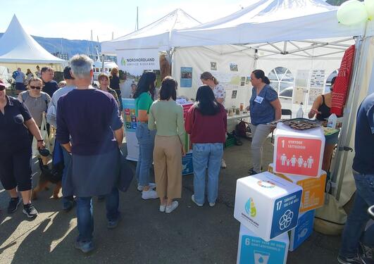 People gathered in front of the UNESCO Biosphere Reserve stand during the knowledge festival