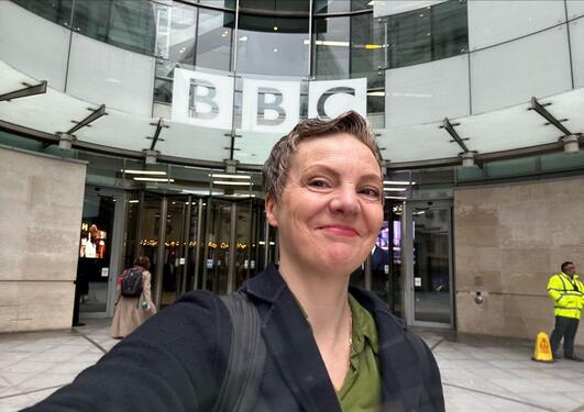 Jill Walker Rettberg smiling in front of the BBC offices.