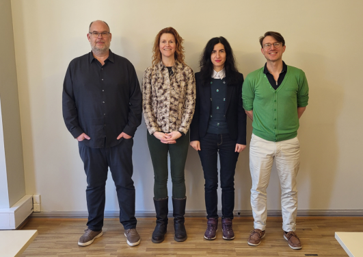 Four professors posing for the photo